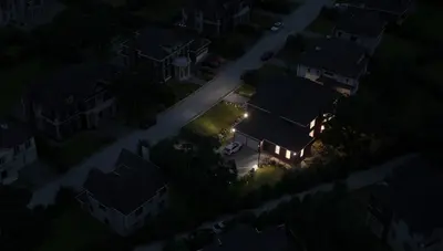 neighborhood-without-power-only-one-house-with-lights-on